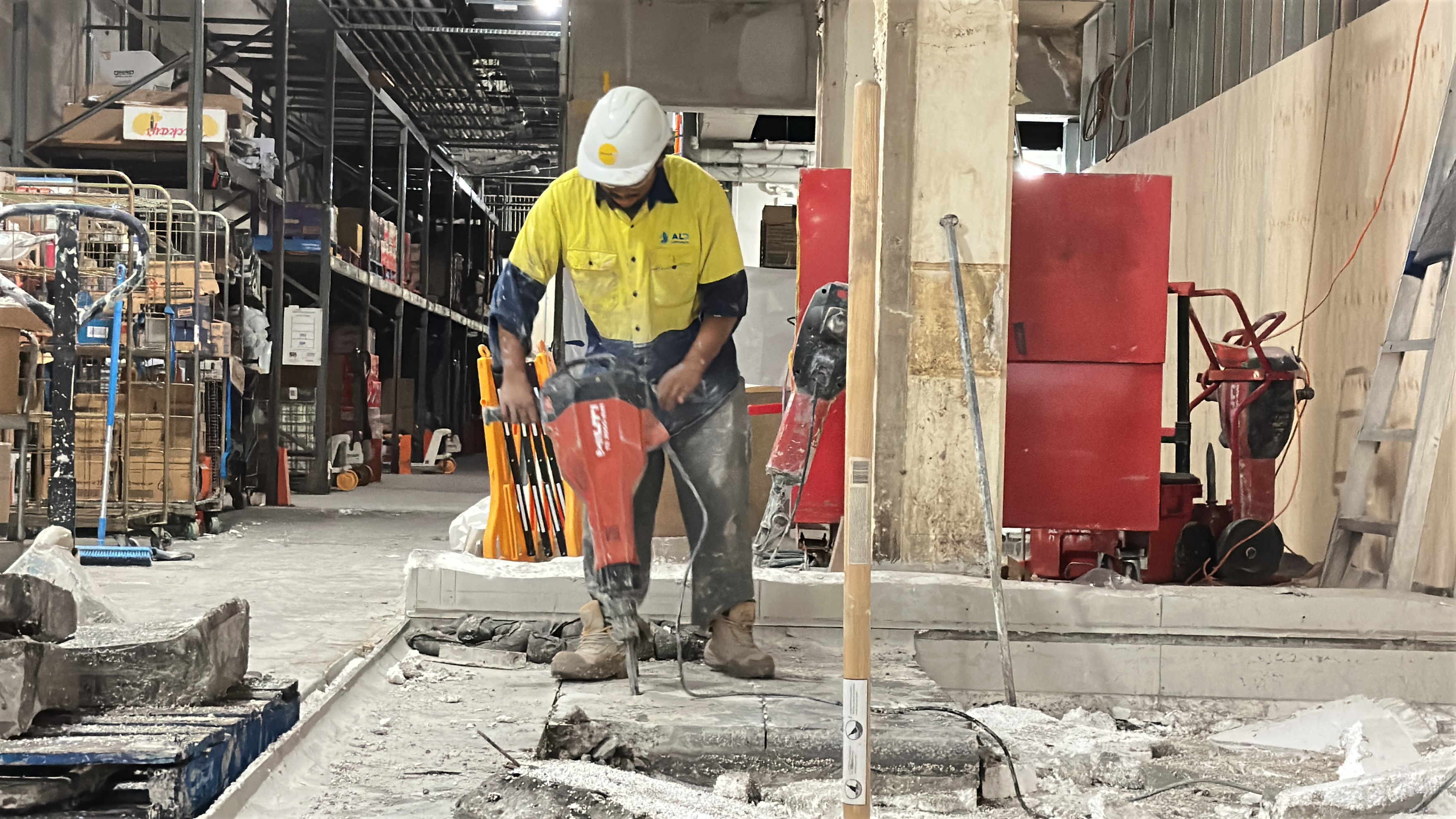 Jackhammer breaking reinforced concrete, Townsville QLD
