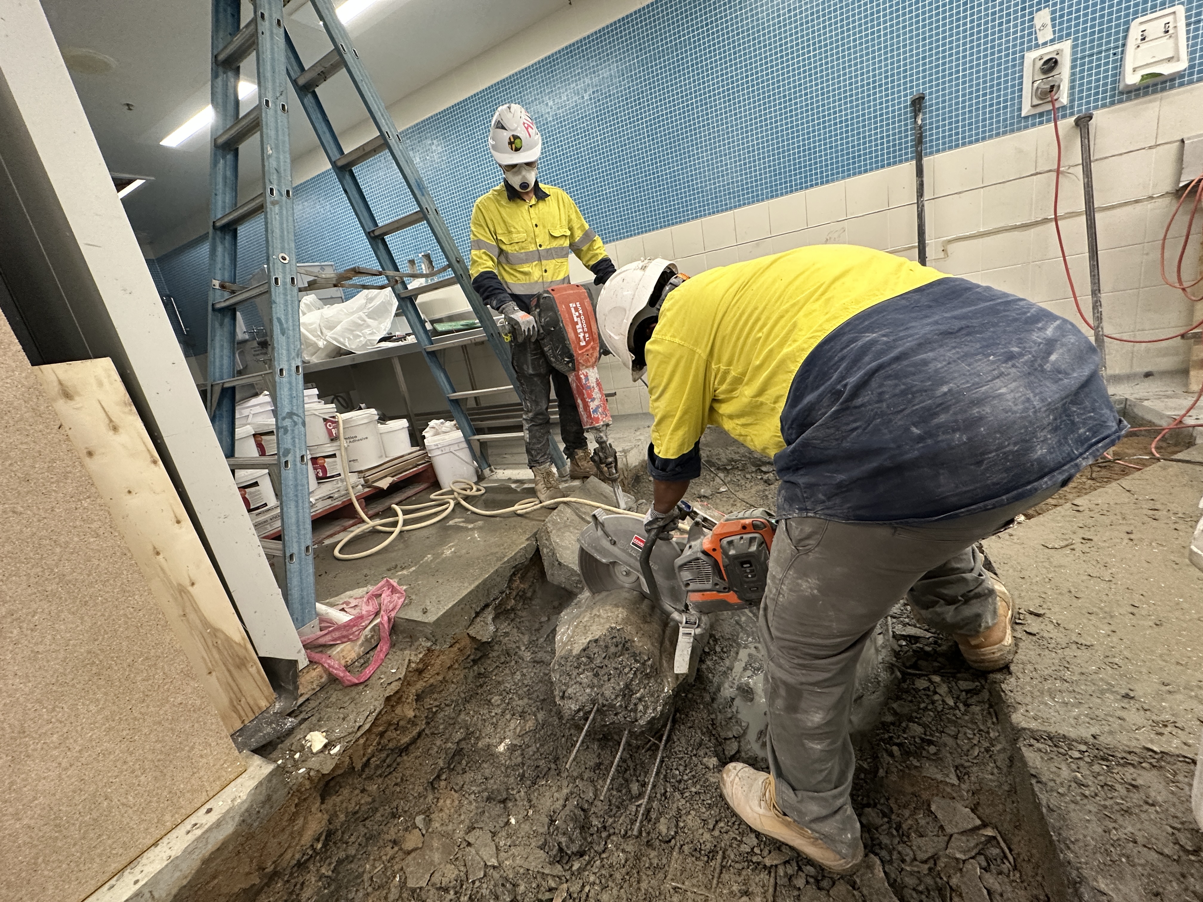Diamond blade saw cutting a reinforced concrete slab, Townsville QLD