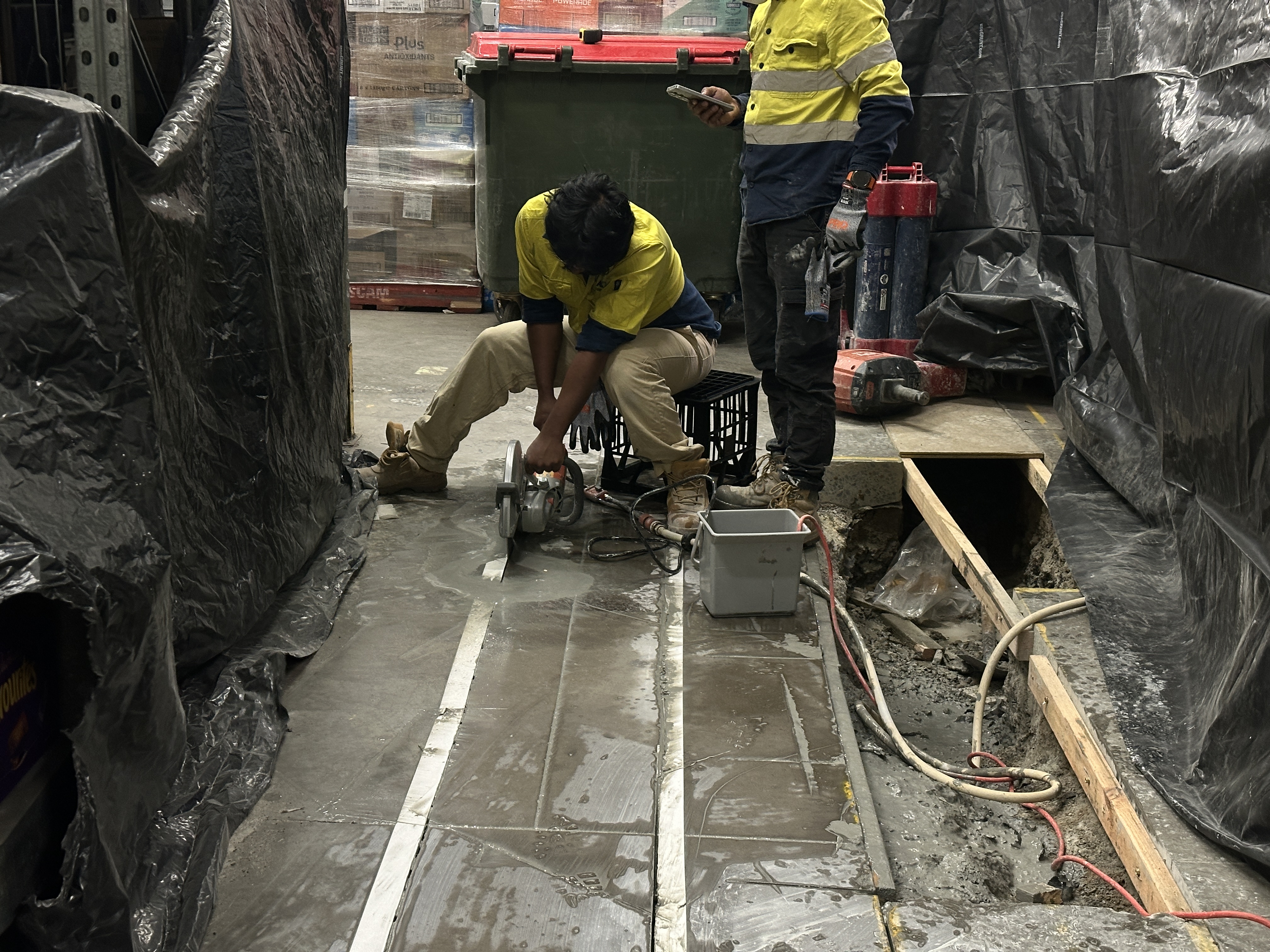 Concrete saw cutting in progress, Townsville