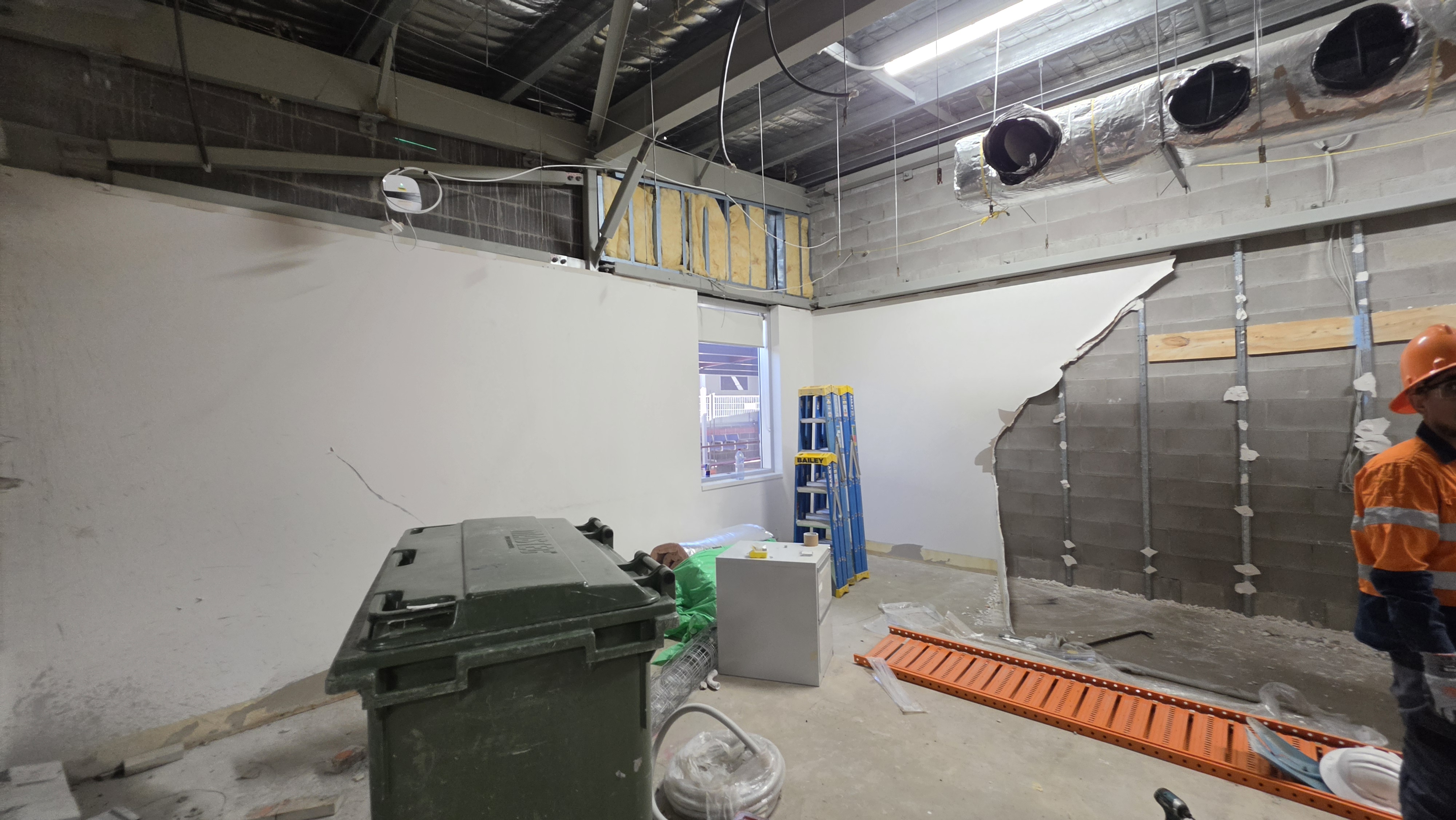 Commercial wall stripoff in progress, Mackay QLD